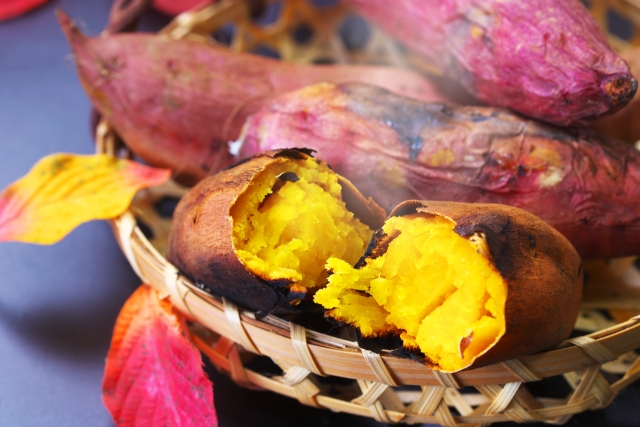 Japanese sweet potatoes, freshly roasted and split open to reveal their golden, soft interior